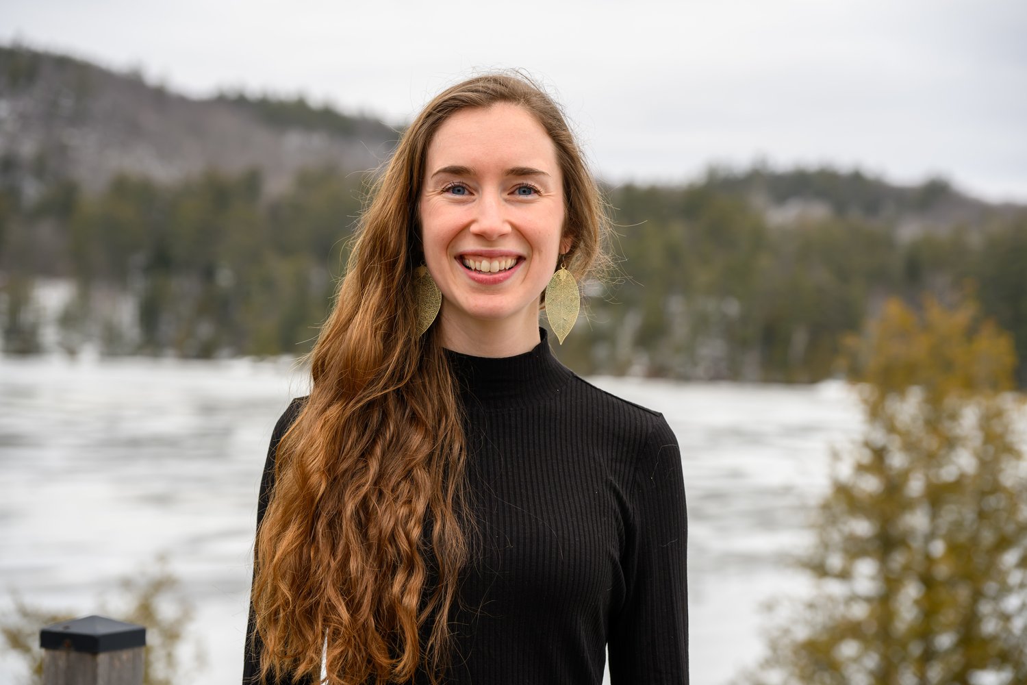 Anna, founder of Oat-EH!, smiling beside an Ontario lake